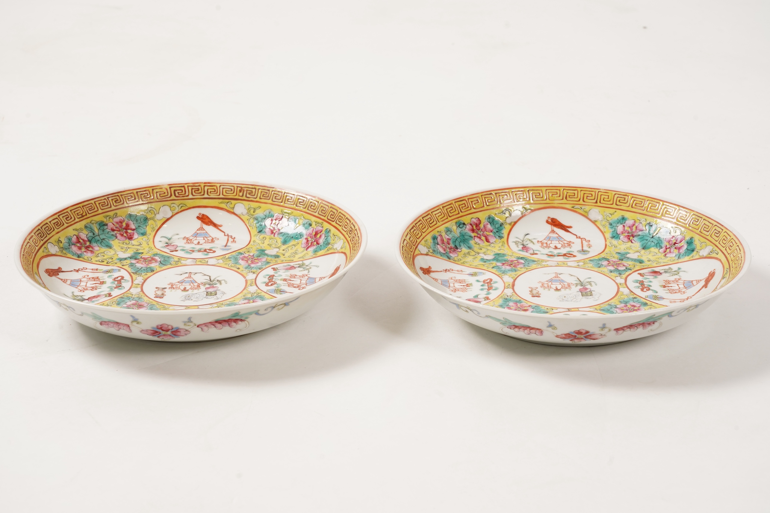 A pair of Chinese yellow ground medallion saucer dishes, Guangxu six character marks, early 20th century